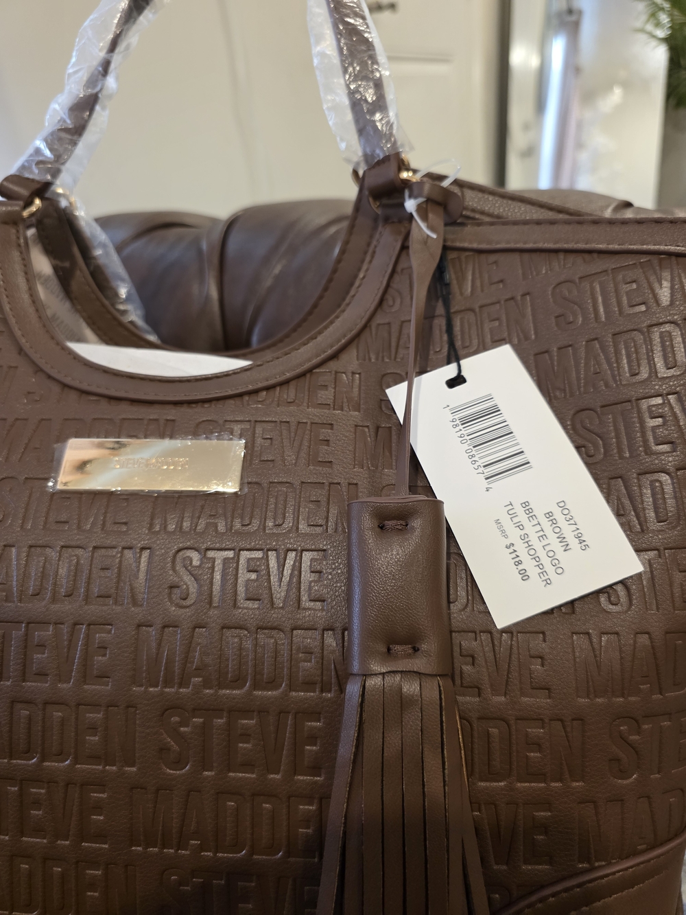 Steve Madden Brown Embossed Logo Messenger Bag with Tassel